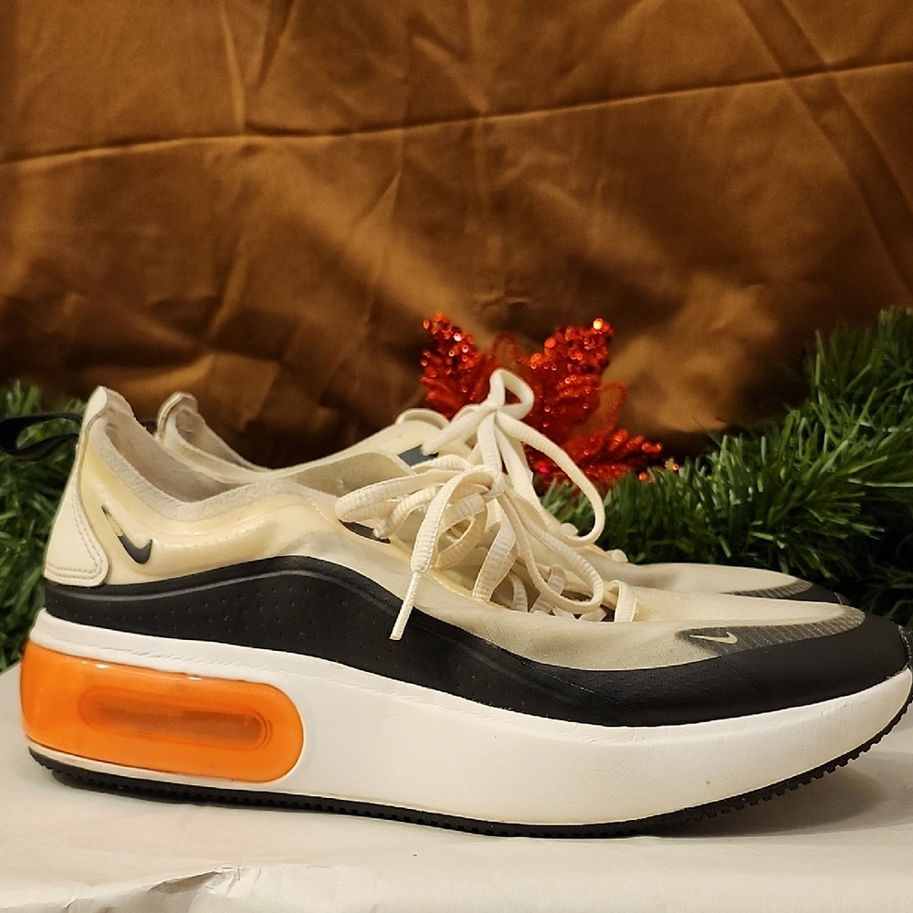 Nike Women's Black and Cream Sneakers with Orange Accent